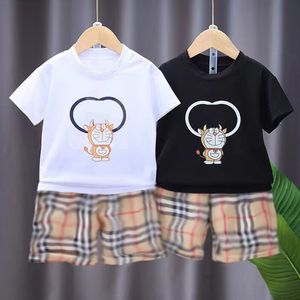 Nouveaux hommes et femmes à la mode enfants d'âge moyen et âgés bébé Dingdang Cat T-shirt à manches courtes short à carreaux classique ensemble deux pièces