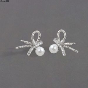 Trendy ontwerper Bow Pearl Earrings Ins Sweet Fairy Sparkling Diamond Cold en High-End F5YD