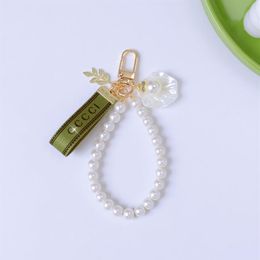 Porte-clés tendance de luxe de luxe pendentif clé boucle classique lettre tissu perles chaîne 4 styles porte-clés de haute qualité Ornamen261U