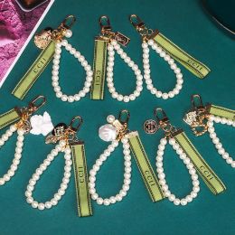 Trendy sleutelhanger luxe designer sleutels hanger sleutel Buckle Classic Letter Fabric Pearls Chain 4 Styles Keychains Ornamenten