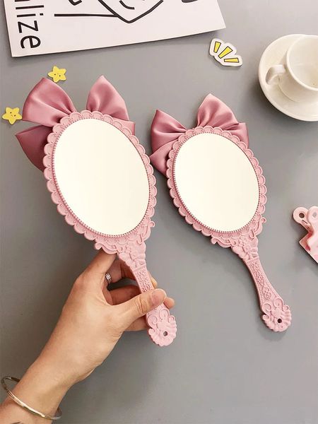 TSHOU632 Mignon bowknot poignée créative miroir de maquillage à main salon de beauté maquillage princesse miroir portable miroir couleur rose 240127