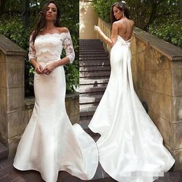 Twee stukken Sexy Lage Back Mermaid Trouwjurken met Applicaties Jas Beaded Sash Elegante bruidsjurken met knopen Vestito da SPOSA SIRENA