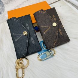 Titulaire de la carte de concepteur unisexe de luxe hommes femmes mini portefeuilles porte-clés en cuir de mode porte-clés porte-monnaie pince à billets porte-carte de crédit 2 couleurs J12050