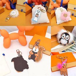 Unisex pluche ball dieren sleutelhanger portemonnee sleutelring ontwerper cartoon auto pinguïn brief fox keychains vrouwen handtas hanger accessori256f