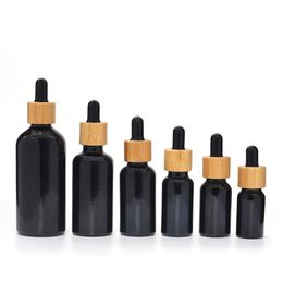 Frascos cuentagotas de material de vidrio negro natural a prueba de luz UV con tapa de bambú 10ML 15ML 30ML 50ML 100ML Botella de aceite esencial SN2808