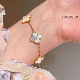 Van Clover Jewelry Cleef Bracelet Quatre Van Designer Trèfle Bracelet Feuille Bijoux 4 Clef Femmes Charme Bracelet Double Face Fleurs Herbe Coquillages Titane Acier Nouveau Fi