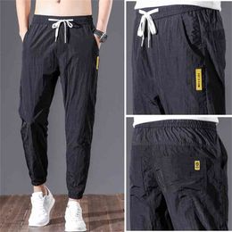 Varsanol Primavera Pantalones para hombre Pantalones de joggers transpirables Moda Streetwear Lápiz de longitud completa Nylon de gran tamaño 28-38 210715