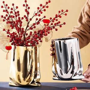 Vasi Nordico vaso di ceramica dorata galvanica sacchetto di stoffa oro vaso di ceramica soggiorno mobile TV mobili decorazione ornamenti vaso 231009