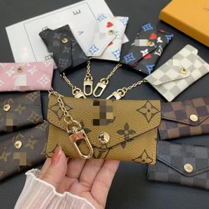 MUY BUENO NUEVO Diseñador de lujo llavero Moda para mujer Mini billetera Alta calidad Cuero genuino Hombres Monedero Color Carteras Titular v