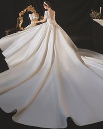 Vestido de novia de una línea vintage para mujer 2023 Perlas Escote corazón Manga corta Con cordones Volver Arco Satén Vestidos de novia por encargo Vestido De Noiva