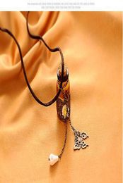 Vintage Little Daisy Glass Bottle Collar de cuero Rope Pearl Butterfly Cadena de suéter Cadena femenina Simple7764231