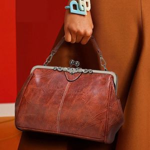 Sacs à main vintage pour femmes fashion kiss verrouillage glisser le sac de couture texture crossbody sac 240510