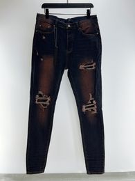 Jeans pour hommes de style vintage beau trou design jeans crayon décontractés jeans de créateurs de luxe