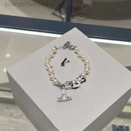 Vivi West -bedelarmbanden Designer Saturnus uitgehold uit volle diamanten pin Pearl -armband voor dames dames luxe sieraden orecchini Bijoux cjewelers