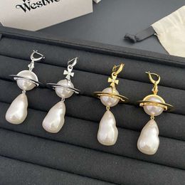 Viviennely Westwoodly Boucles d'oreilles Saturn exagèrent les boucles d'oreilles avancées avec des boucles d'oreilles en perles géantes de tempérament