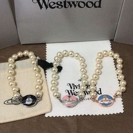 Viviennes Viviane Westwood Bijoux Bracelet Femmes Haute Qualité Tang Porcelaine Perle Boucle Magnétique Saturne Bracelet Planète Perle Bracelet Polyvalent