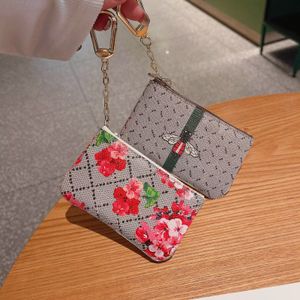 Billetera para hombres diseñador diseñador llavero de cuero de cuero de cuero marca colorida con cremallera de flores con tarjeta de crédito bolso