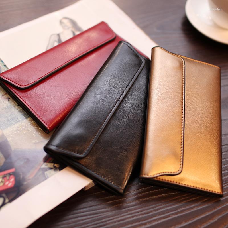 Plånböcker 2023 Europeiska och amerikanska långa plånbok Kvinnors äkta läderspänne Simple Business Cowhide Thin Card Trendy