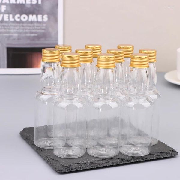 Bouteilles d'eau 10pcs 50ml mini clair PET rechargeable petit vin pour la liqueur de mariage de fête avec couvercle à vis anti-fuite