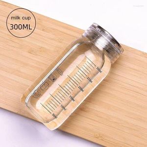 Bouteilles d'eau bouteille en verre avec un marqueur de temps tasse de couverture pour boire un bois de lait transparent.