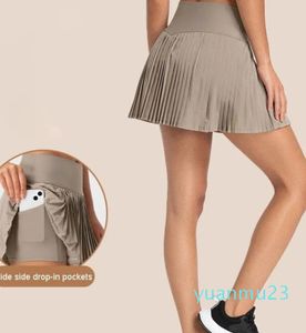 Jupes doublées en tissu refroidi à l'eau, doublure intégrée, poche latérale, jupes plissées en mélange de coton, pantalons de survêtement à trois points