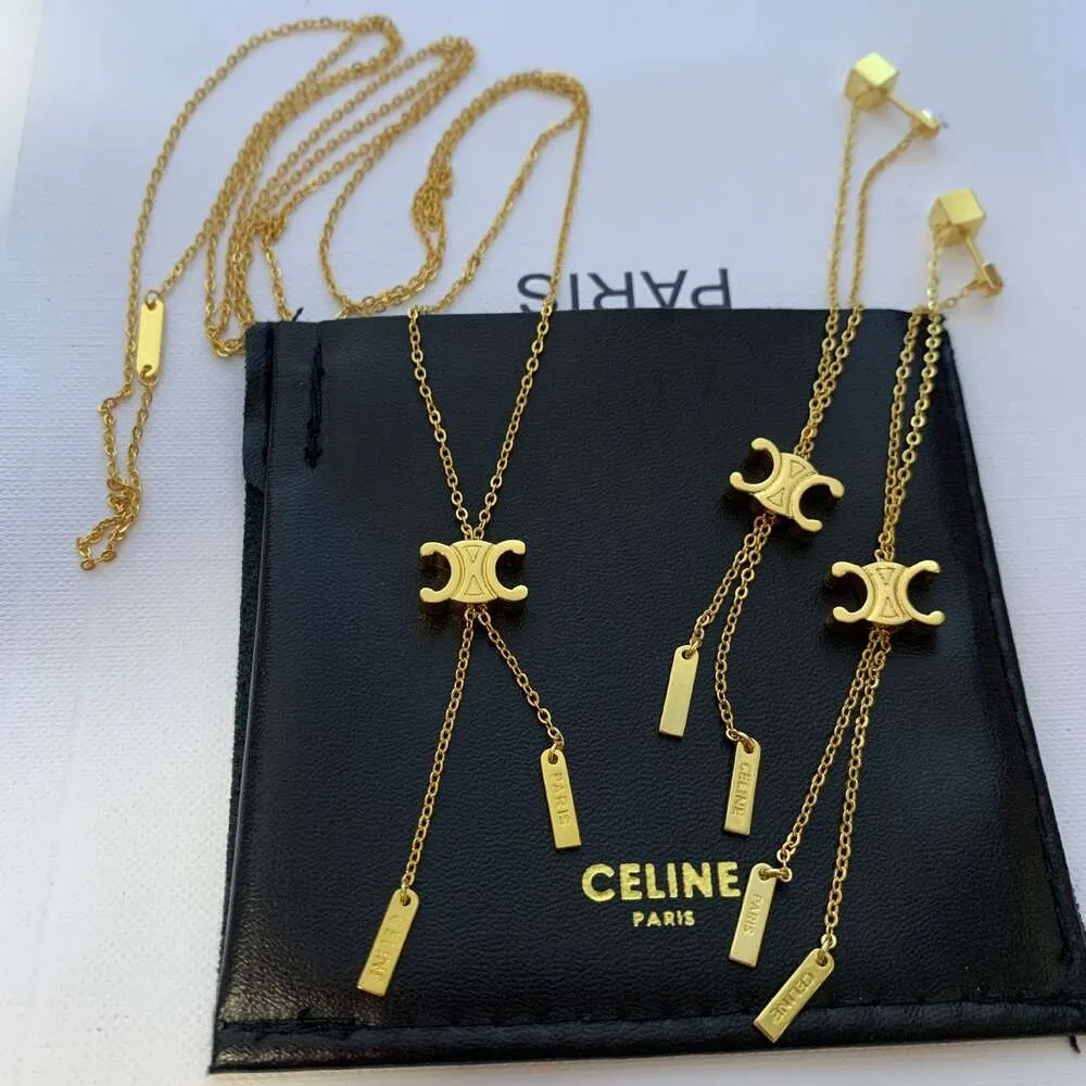 Ce Arc de Triomphe Långt dragbart guld tofs halsband för kvinnor med avancerad designkänsla, liten och avancerad tröja kedja