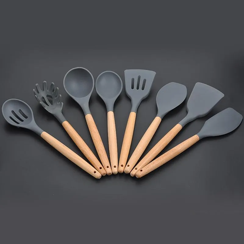Acquista Set di utensili da cucina da 11 pezzi Set di utensili da cucina in  silicone Spatola antiaderente Pala Manico in legno Utensili Accessori da  cucina