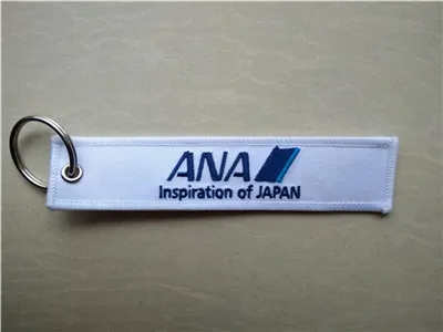 Ana Inspiration du Japon Retirer avant le vol Porte-clés en tissu brodé 13 x 2,8 cm / 