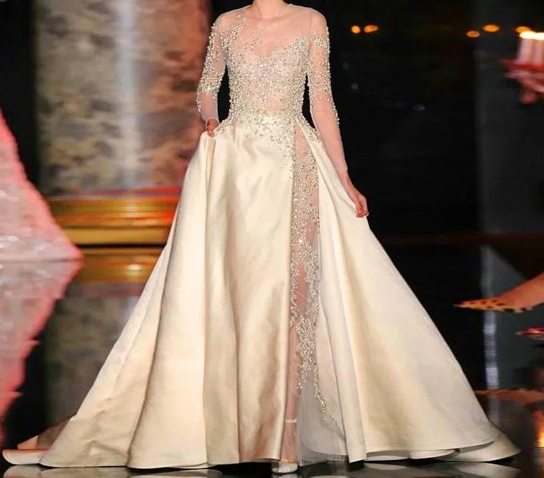 2015 Elie Saab Dresses Sheer Zroszony Puffy A-Line Sweep Pociąg Satyna Długie Formalne Suknie z aplikacjami Długie Rękawy Celebrity Suknie Suknie