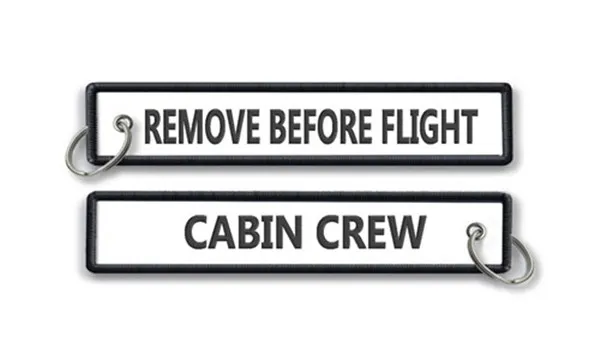 Supprimer avant les étiquettes en tissu de l'équipage de cabine de vol