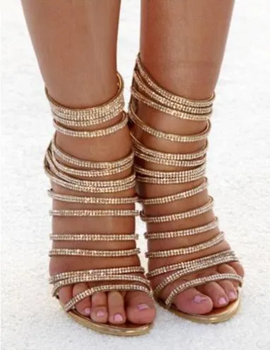 Sandalias sexis de cristal dorado con punta abierta para mujer, sandalias de gladiador con tacones altos y tiras de diamantes de imitación de lujo, tacones de aguja para fiesta en club nocturno para mujer