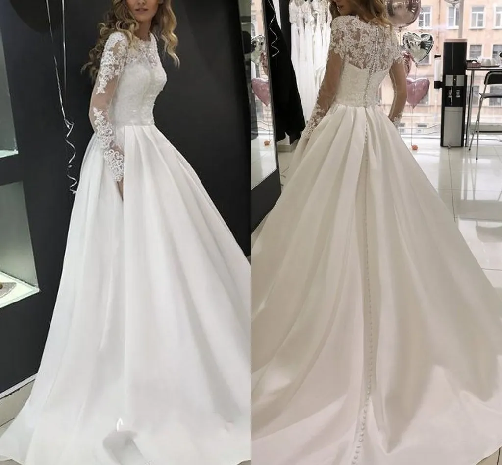 A-line 2020 Dantel Gelinlik mücevher Illusion Uzun Kollu Düğmeli Fermuar vestidos de Novia See rağmen Geri Gelin Gelinlikler
