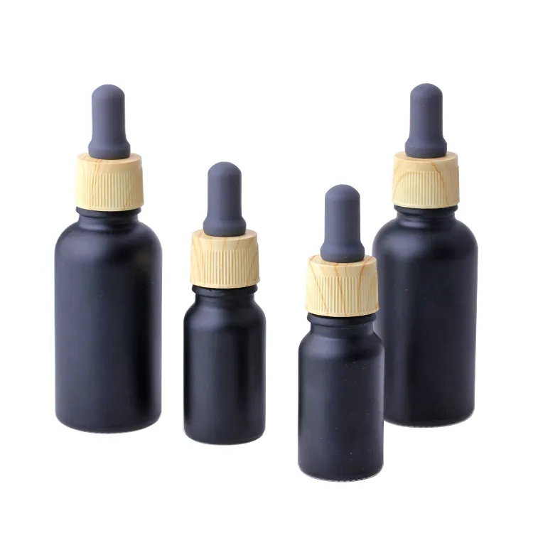 Bottiglia di profumo di olio essenziale in vetro nero opaco e bottiglia di profumo con pipetta reagente e tappo a grana in legno 10 / 30ml