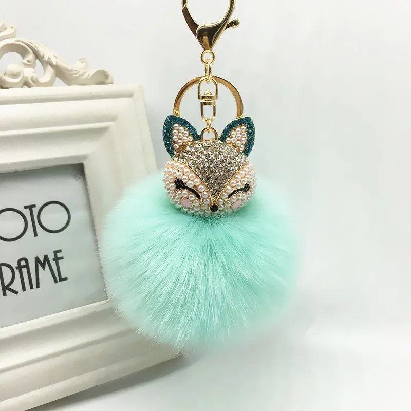 Winter Faux Rabbit Päls Ball Keychain med Rhinestone Fox Head Keyring Pompom Fluffy Key Chains Crystal for Women305s