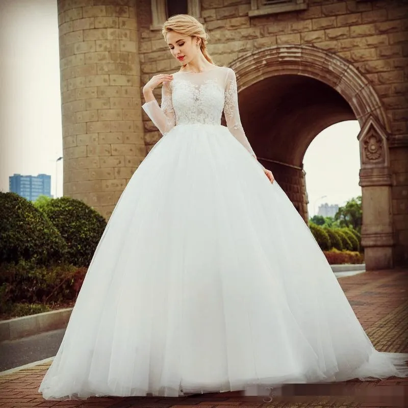 2019 Long Sleeves Ballgown Wedding Dresses Sheer Neck Lace Applique Sweep Train Chic Illusion Covered Buttons Back Wedding Bridal Gown