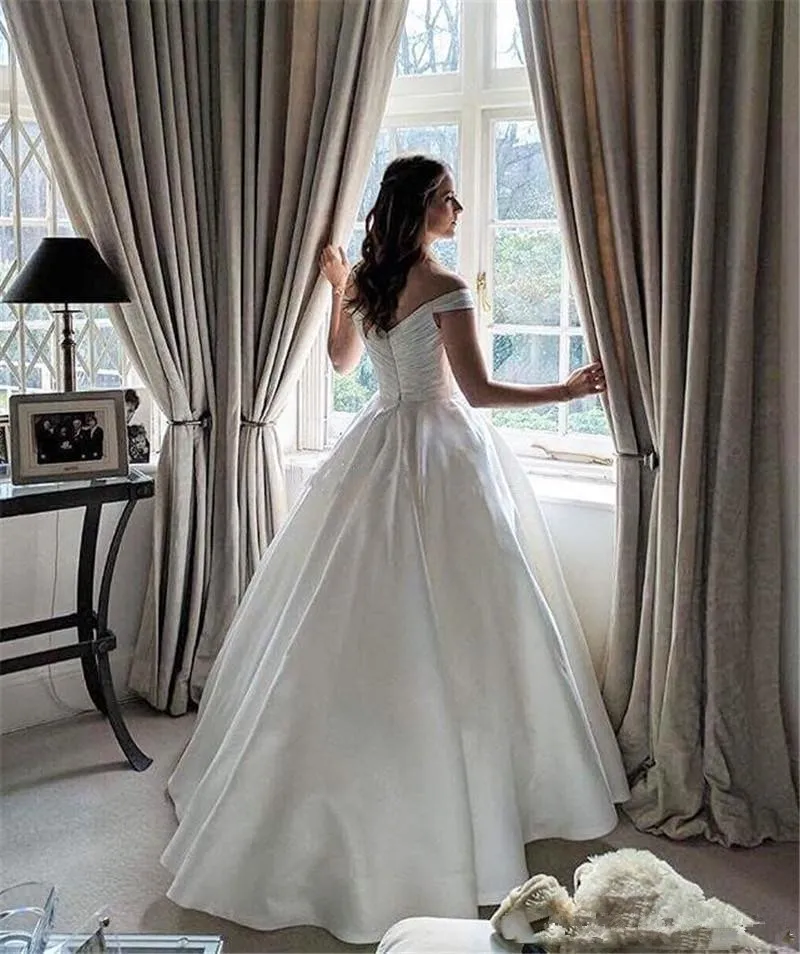 Off Shoulder Satin Wedding Dress With Pockets With Short Sleeves Pockets And Arabic Sweep Train Customizable A Line Bridal Gown Q54 From Lilliantan 135.83 DHgate.Com