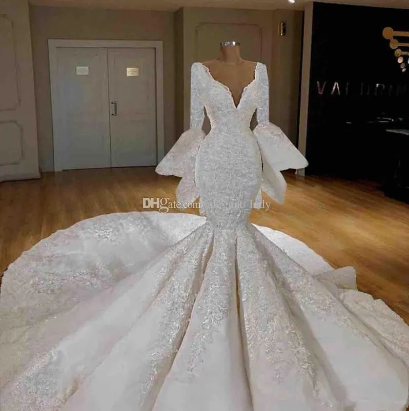 Abiti da sposa a sirena 2020 con maniche lunghe di lusso in pizzo con applicazioni di ricamo con volant arabo Dubai caftano abiti da sposa abito da sposa