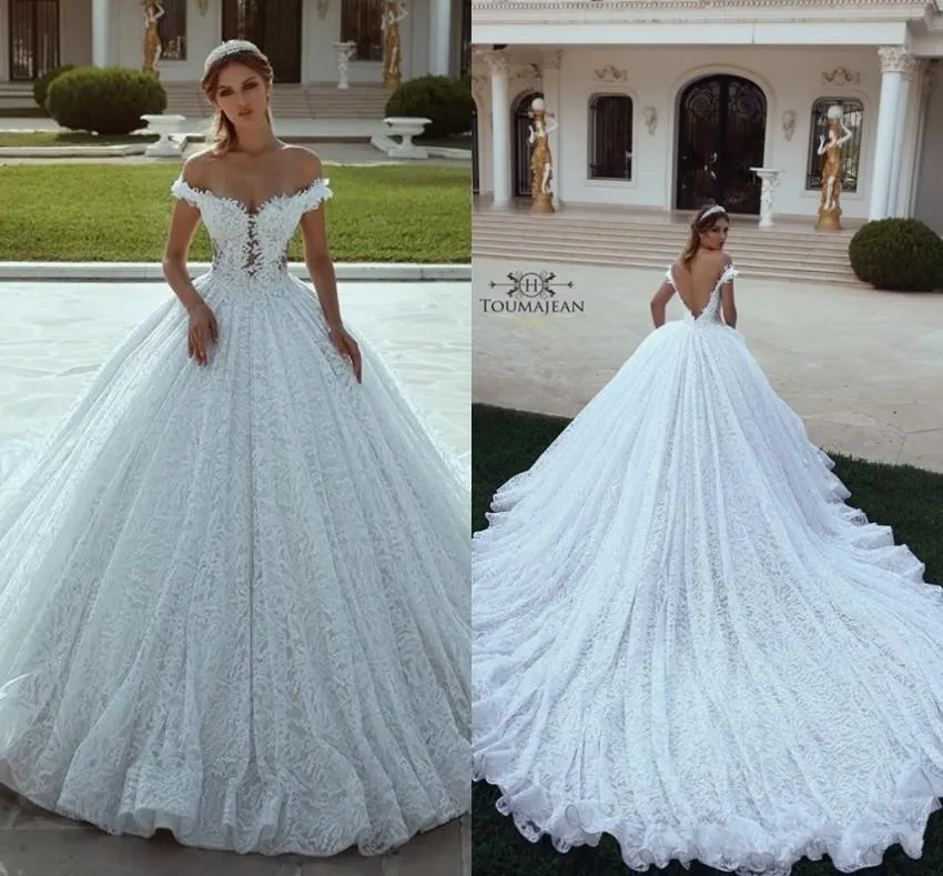 Nuovo design A Line Abiti da sposa 2020 Applicazioni in pizzo Perline Maniche ad aletta Apertura sul retro Corte dei treni Arabia Dubai Abiti da sposa personalizzati taglie forti