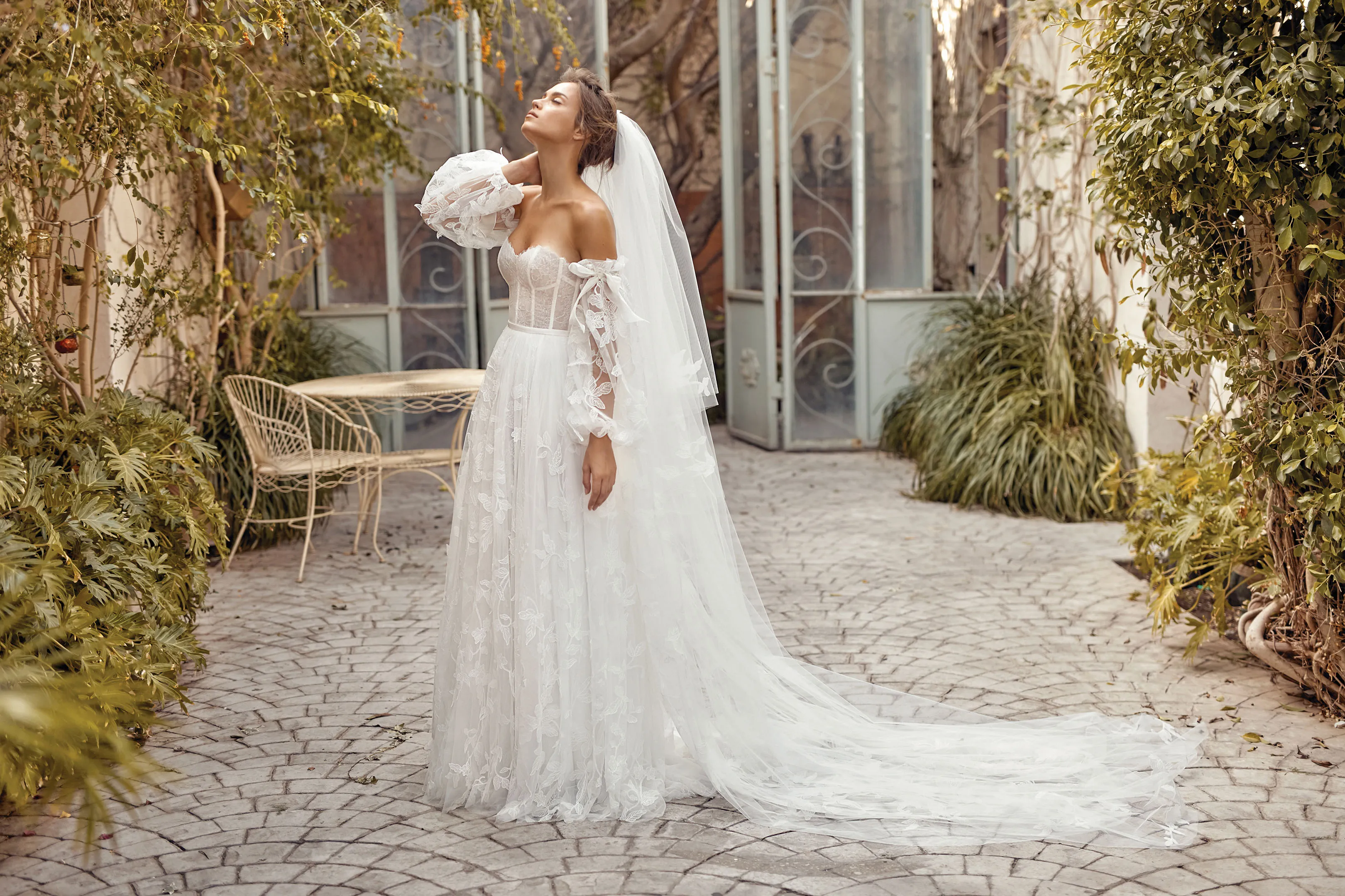 lihi hod long sleeve wedding dress Introducing Chen, an expression of allure and precision, crafted for the bride who moves with quiet confidence. LUMIRE Collection. An off-the-shoulder lace gown featuring a sweetheart neckline, long fitted sleeves,
