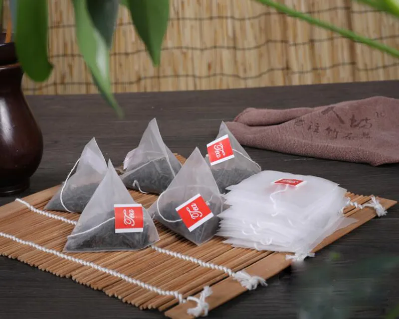 10000pcs / mycket nya pyramid nylon tepåsar tomma transparenta teabags med strängfilter tepåse