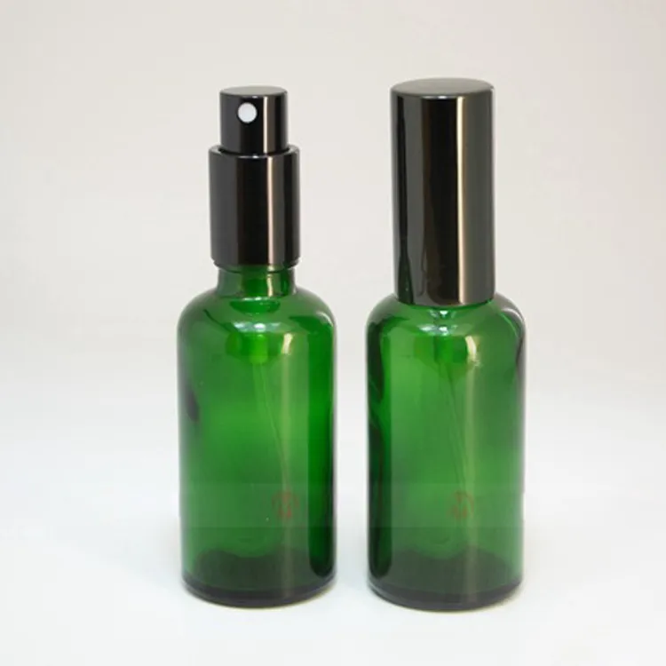 Botellas de bomba de spray de vidrio verde de gran venta 30 ml 50 ml 100 ml con tapa de metal SS de oro negro para perfumes cosméticos