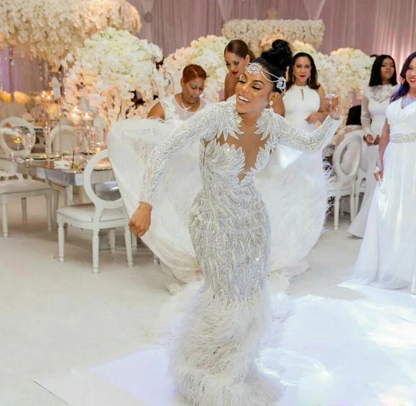 Long sleeve discount feather wedding dress