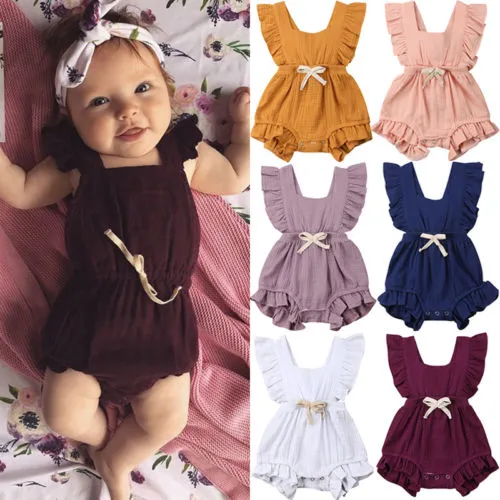 6色かわいい赤ちゃんの女の子のフリルソリッドカラーロンパースジャンプスーツ衣装衣装のためのサンスーツ子供服子供服