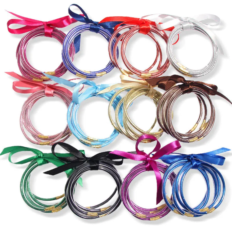 Braccialetti glitterati Braccialetti alla moda in gelatina per le donne Alla moda con glitter riempiti di plastica con nodo a fiocco Nastro per ragazze Regali per feste Bracciali con gioielli in silicone