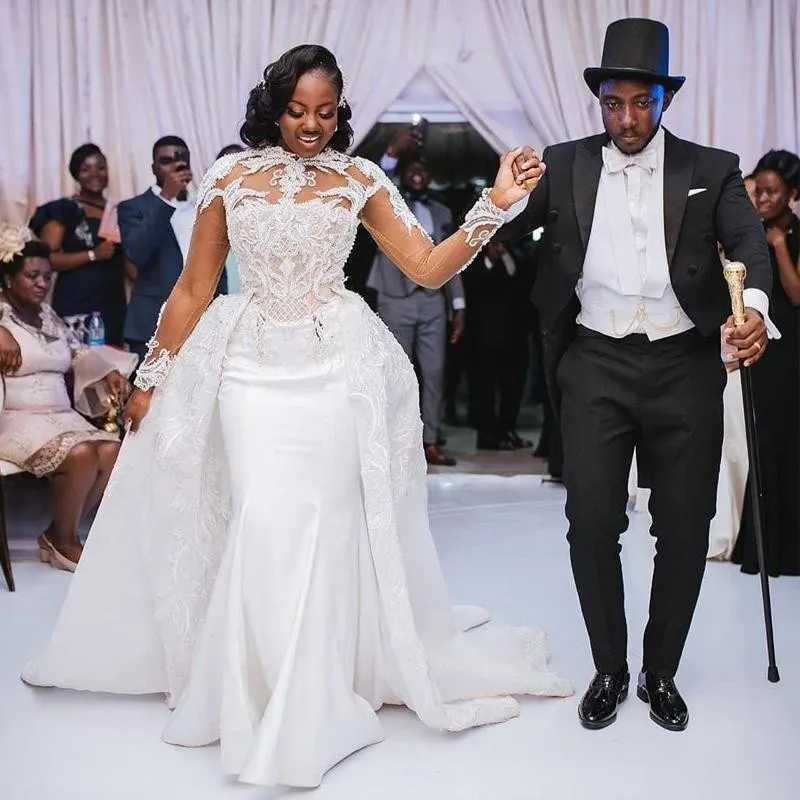 Afrikanska Plus Size 2021 bröllopsklänningar i satäng med avtagbart tåg Höghalsad spets Applikerade långärmade sjöjungfrubrudklänningar Vestidos