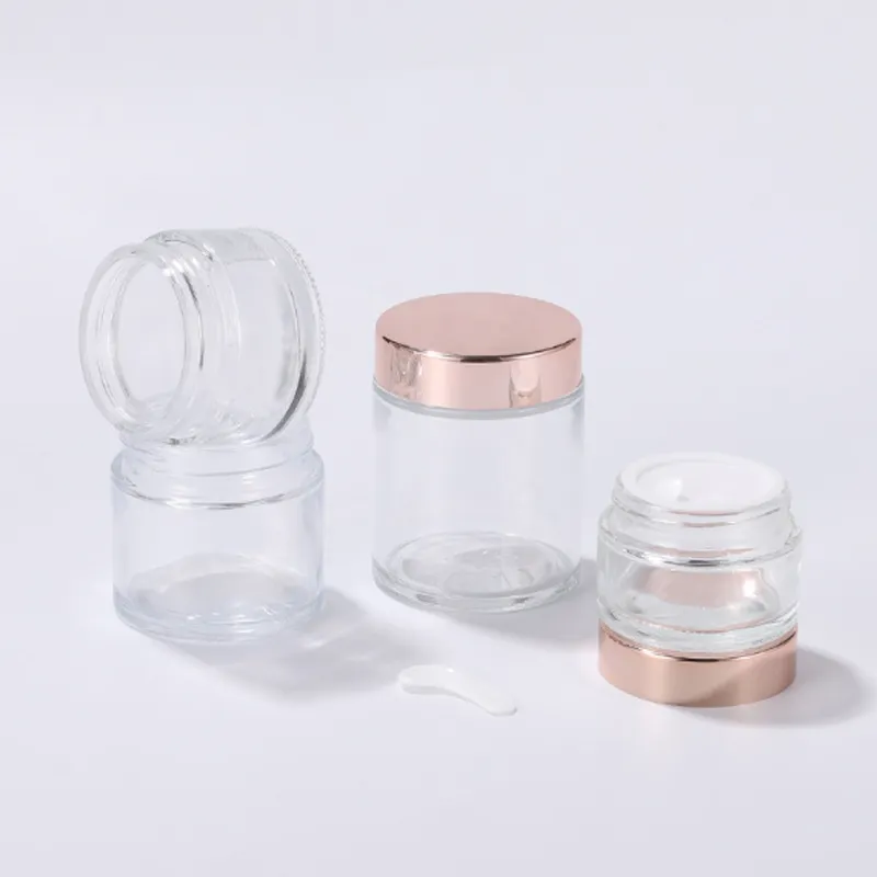 L'emballage des soins de la peau met en bouteille un pot de crème en verre transparent pour cosmétiques de 5 à 100 g avec des couvercles en or rose brillant