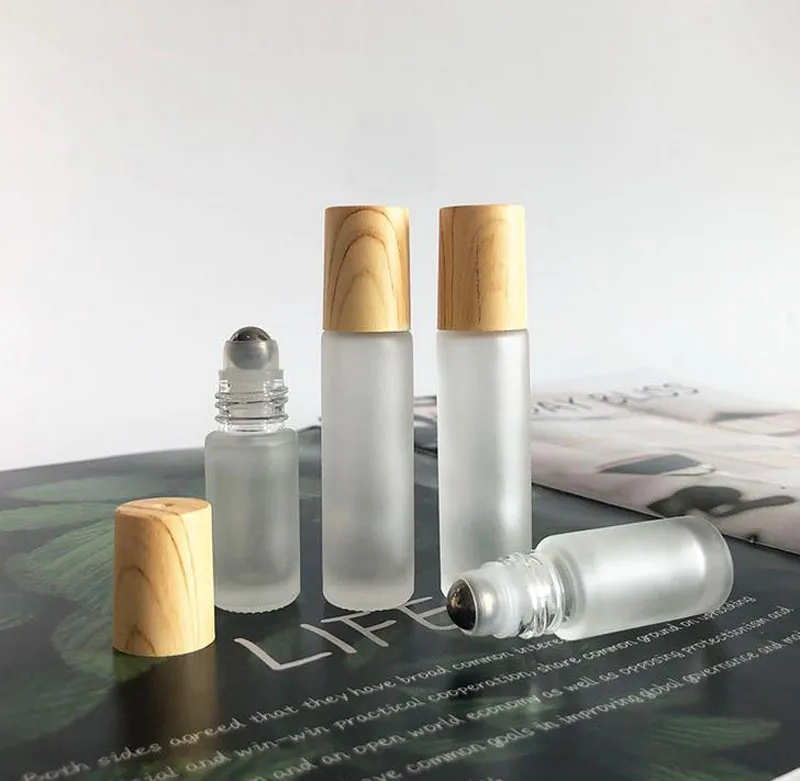 100pcs 5ml 10ml Frosted Clear Glass Roll On Bottle with Wood Grain Plastic Cap Stainless Steel Metal Roller Ball Essential Oil 1 2 3 ml Vials by free express