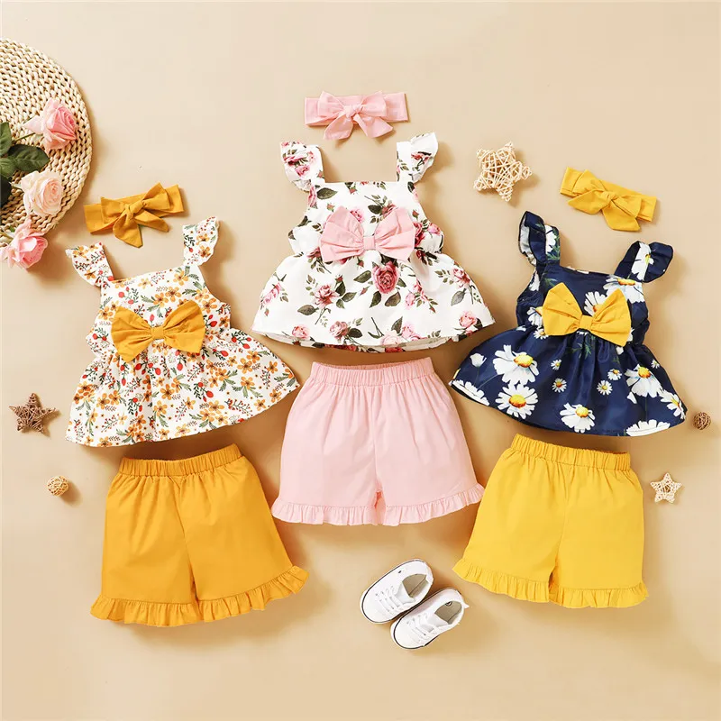 Ny 2020 Baby Girl Clothes Set Summer Toddler Kids Floral Ärmlös Bow Top Shorts Headband 3pcs Baby Clothing Set Girls Outfits 12m-4t