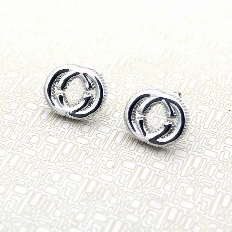 Europe Amérique Simple Style Lady Femmes Titane Acier G Initiales Argent Boucles D'oreilles