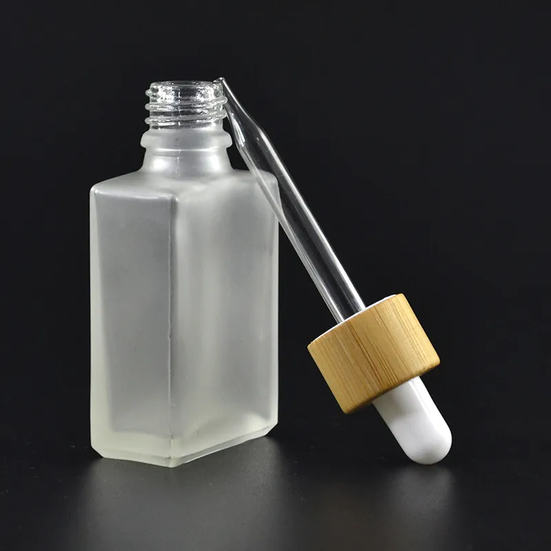 30 ml Botellas de gotero de vidrio claro / esmerilado Frascos de reactivo líquido Pipeteado cuadrado de aceite esencial Botellas de perfume de aceite de humo E Botellas de líquido Bambú gorra